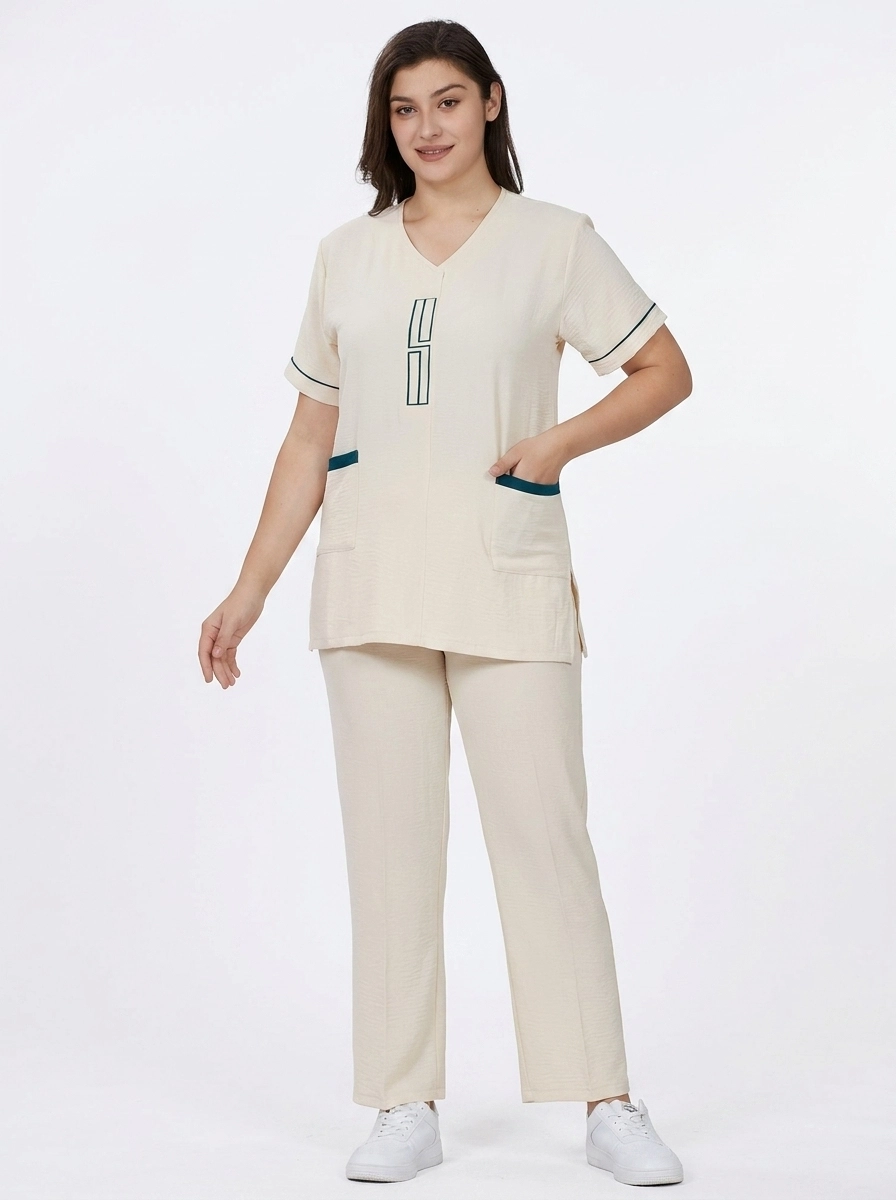 Model_wearing_healthcare_uniform_202607131016 Geometric Embroidered V-Neck Professional Uniform Scrub Set - Image 1