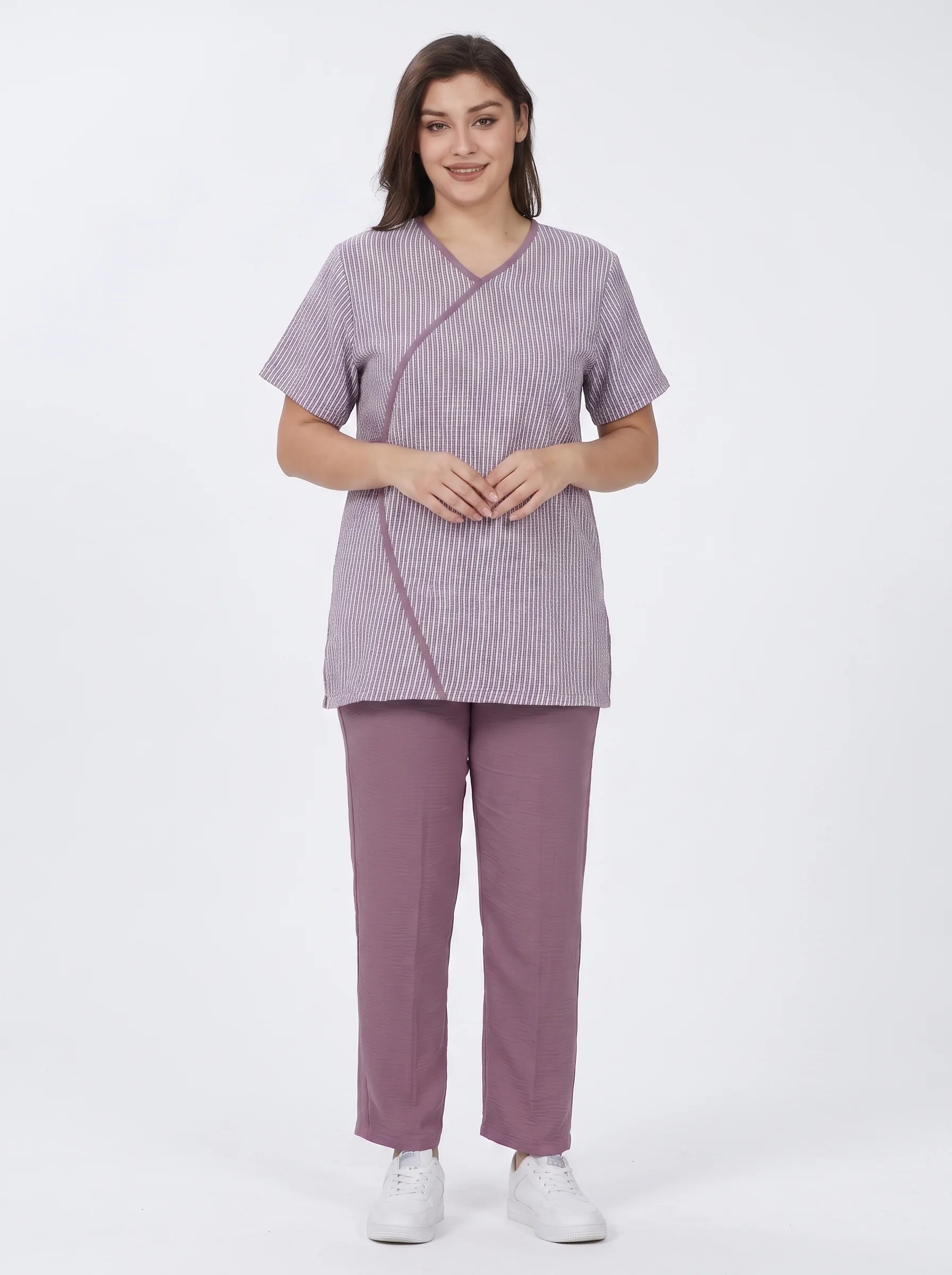 Model_wearing_healthcare_uniform_2K_202607091813 (1) Striped Mock-Wrap Uniform - Image 1