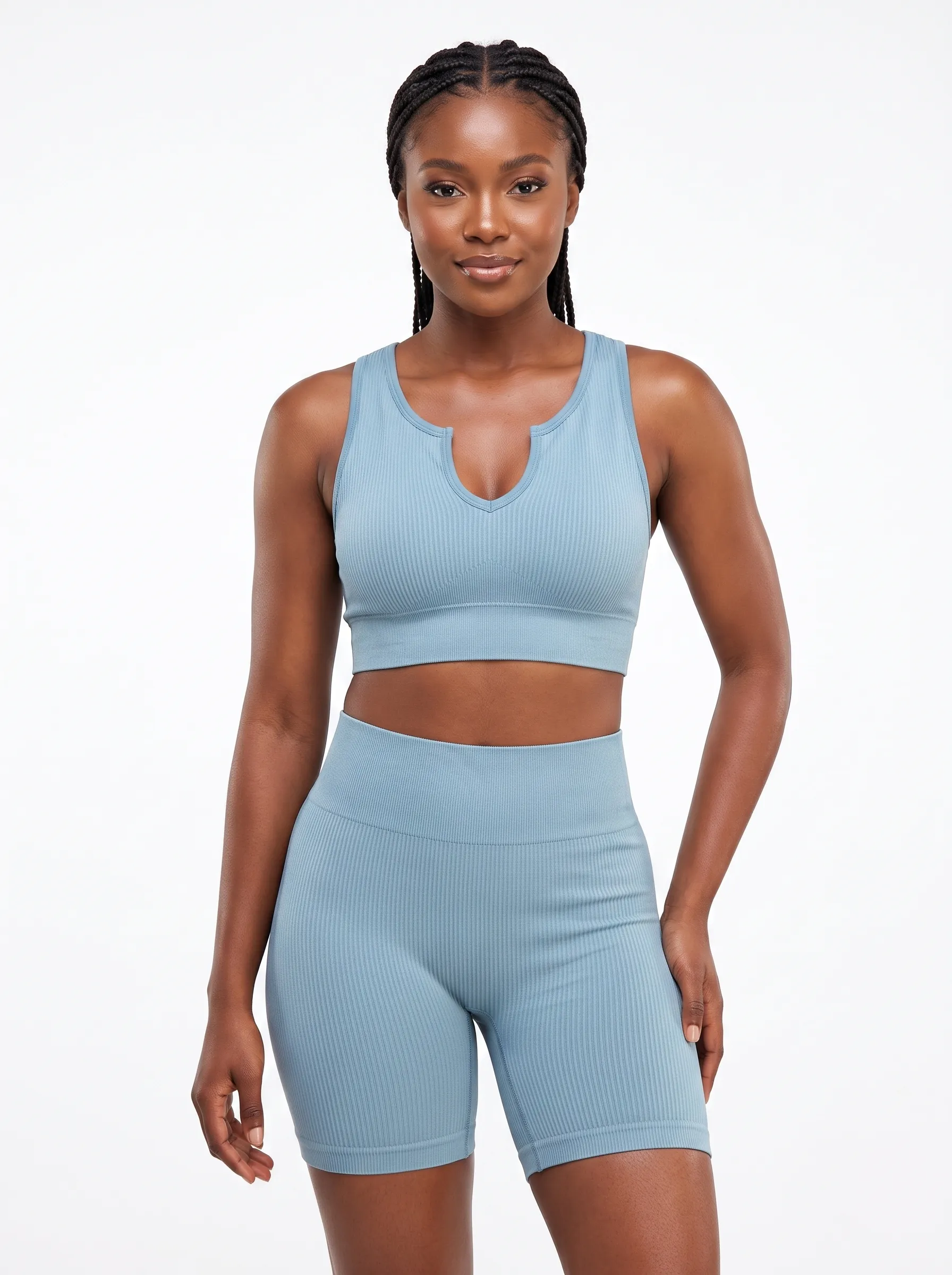 Model_wearing_sports_bra_shorts_202607092017 Women's Seamless Ribbed Notched-Neck Crop Top & Biker Shorts Set - Image 1