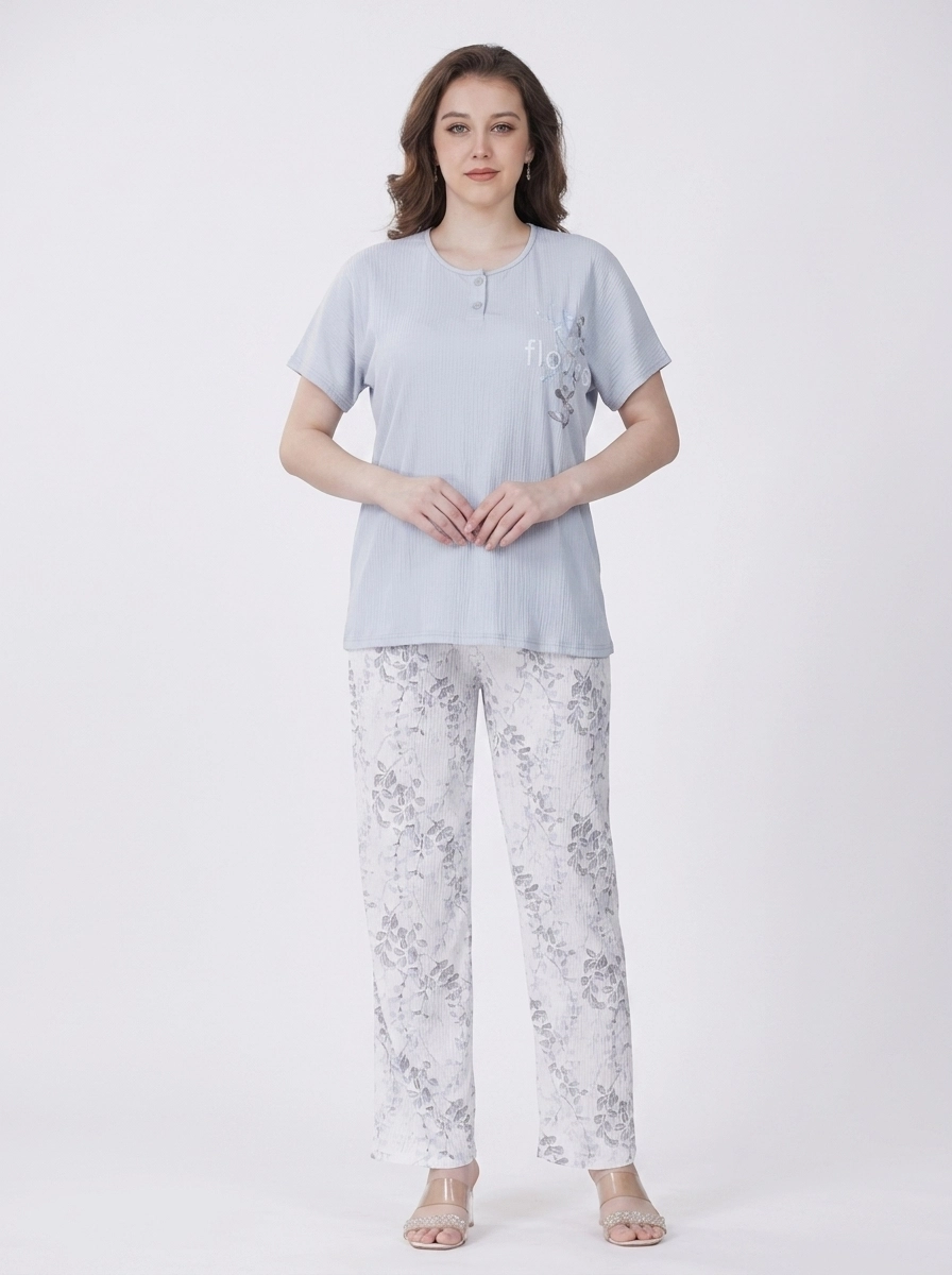 Woman_in_pajama_top_pants_202607101851 (1) Women's Floral Print Henley Neck Ribbed Pajama Set - Image 1