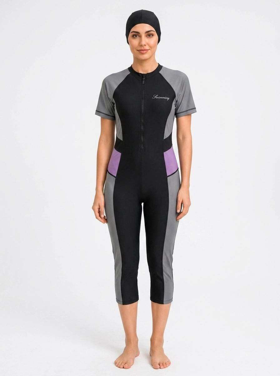 Woman_wearing_black_swimwear_202607100327 (2) Women's Colorblock Modest One-Piece Swimsuit Set - Image 1