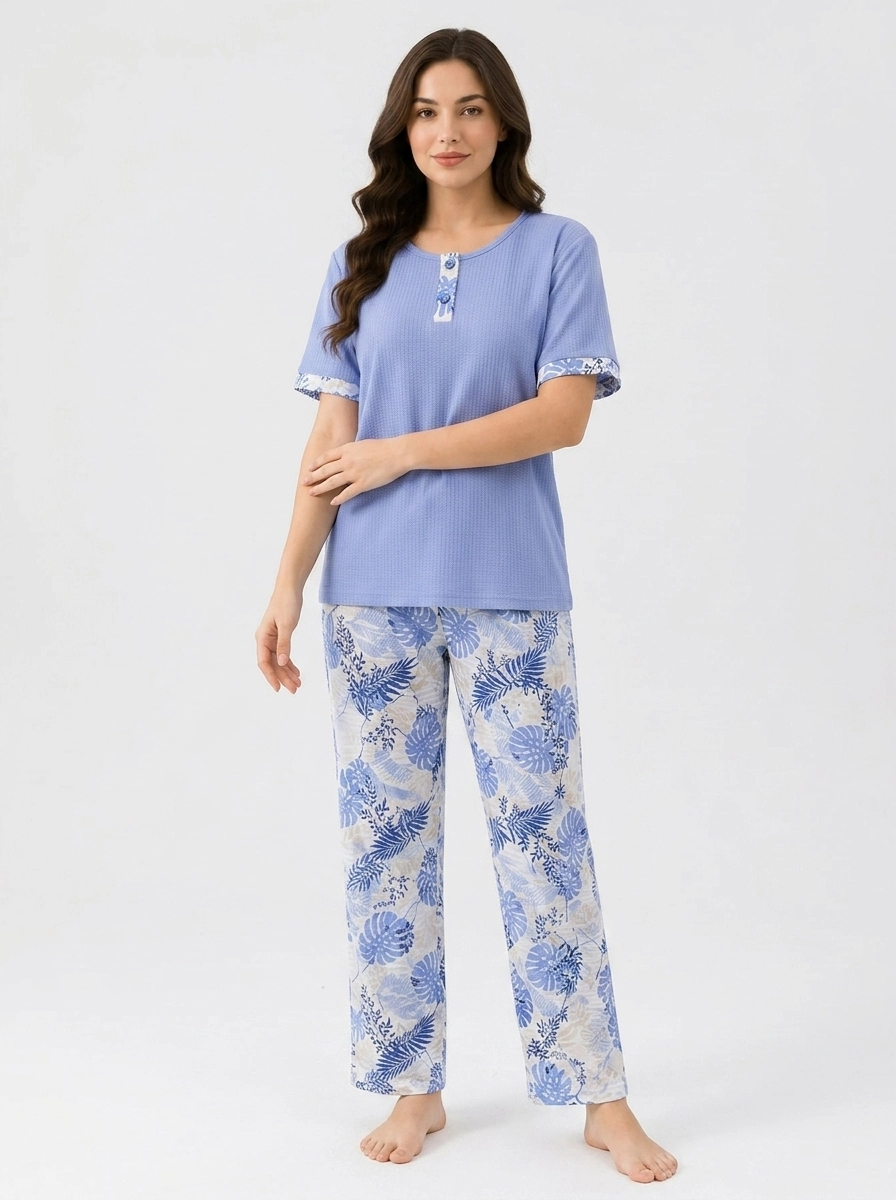 Woman_wearing_blue_pajama_set_202607150711 Peri Blue Tropical Henley Loungewear Set - Image 1