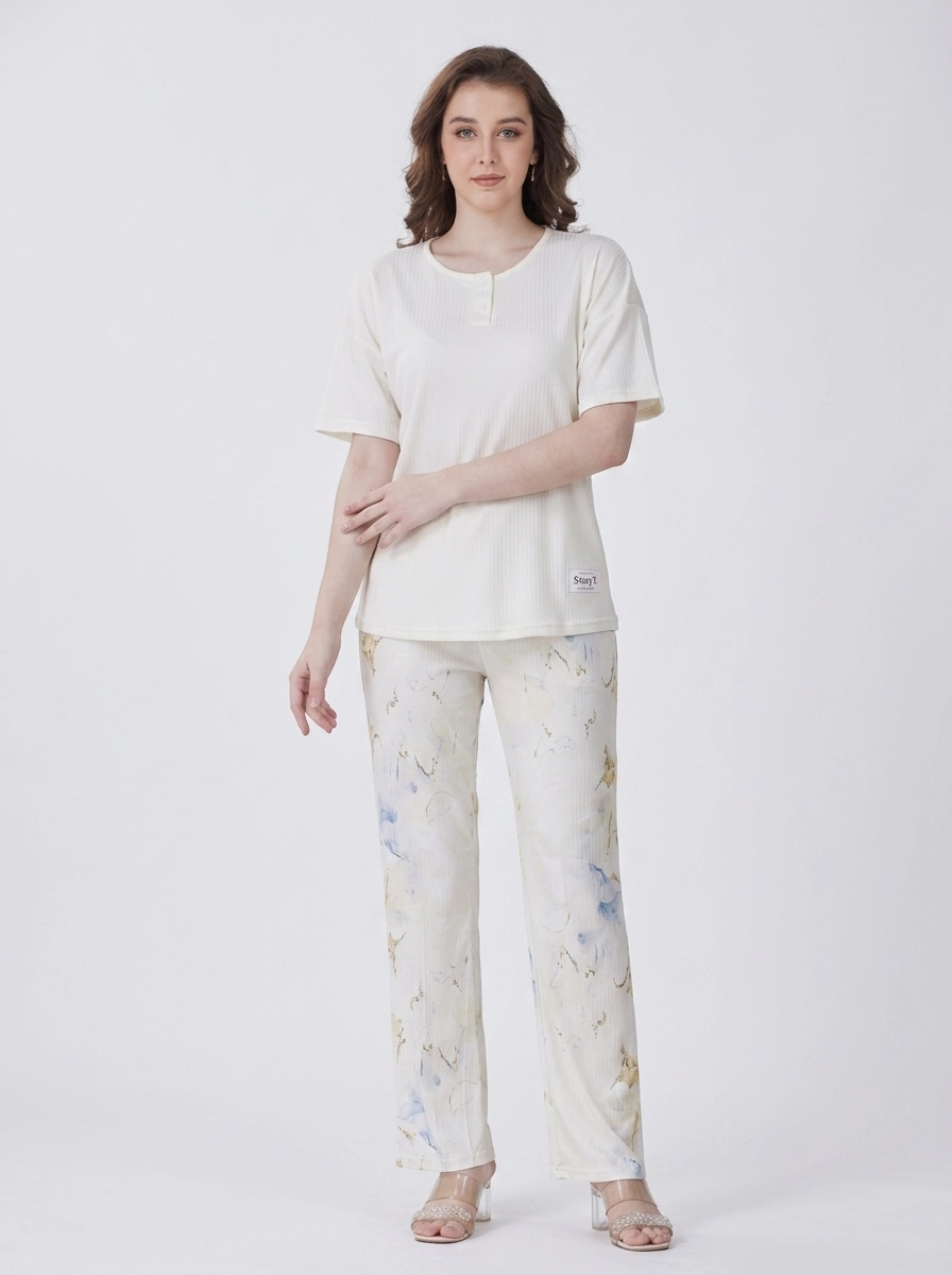Woman_wearing_cream_top_pajama_202607150610 (2) Ivory Marble Henley Loungewear Set - Image 1