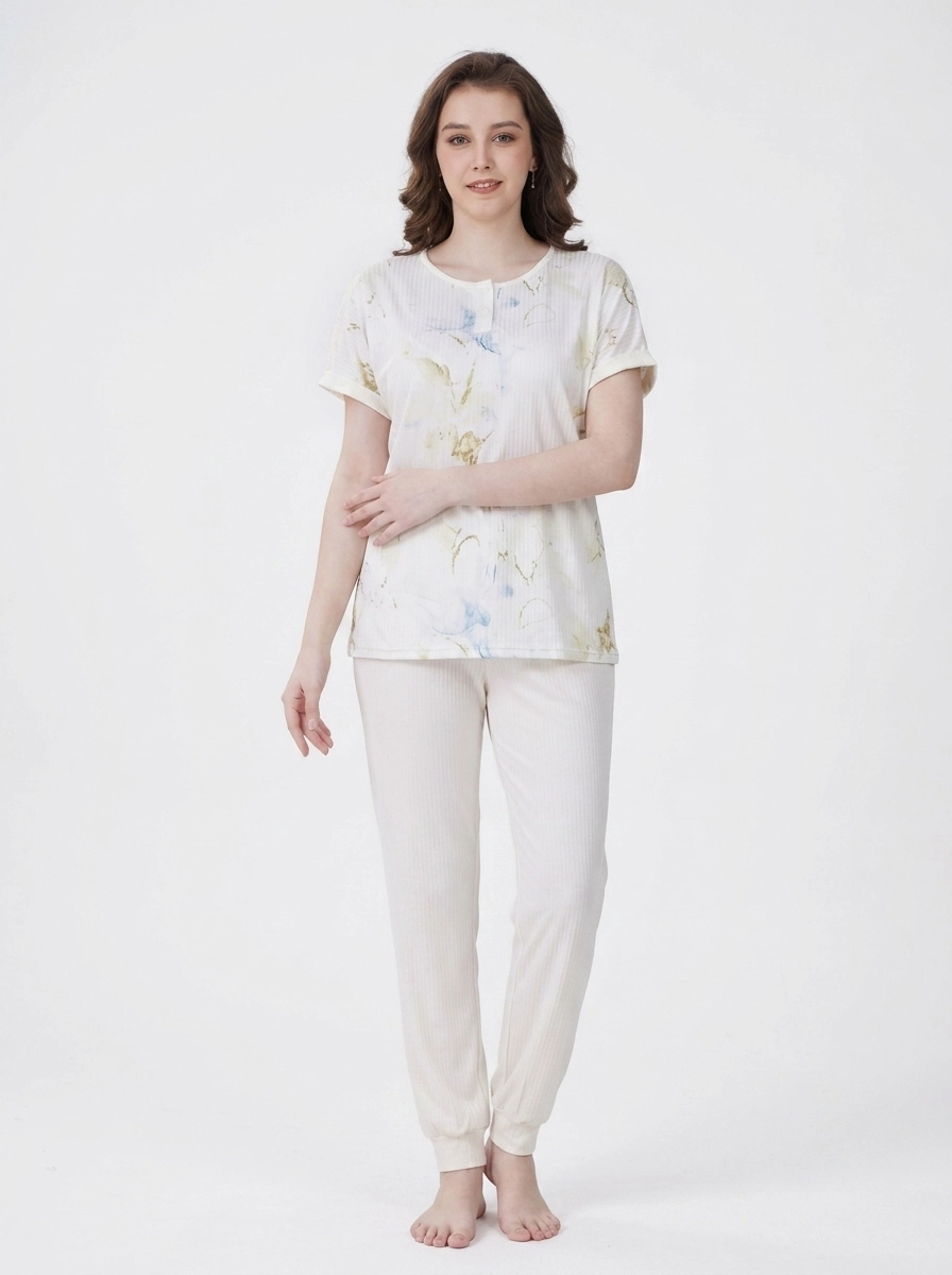 Woman_wearing_pajama_set_202607150602 Ivory Marble Henley Loungewear Set - Image 1