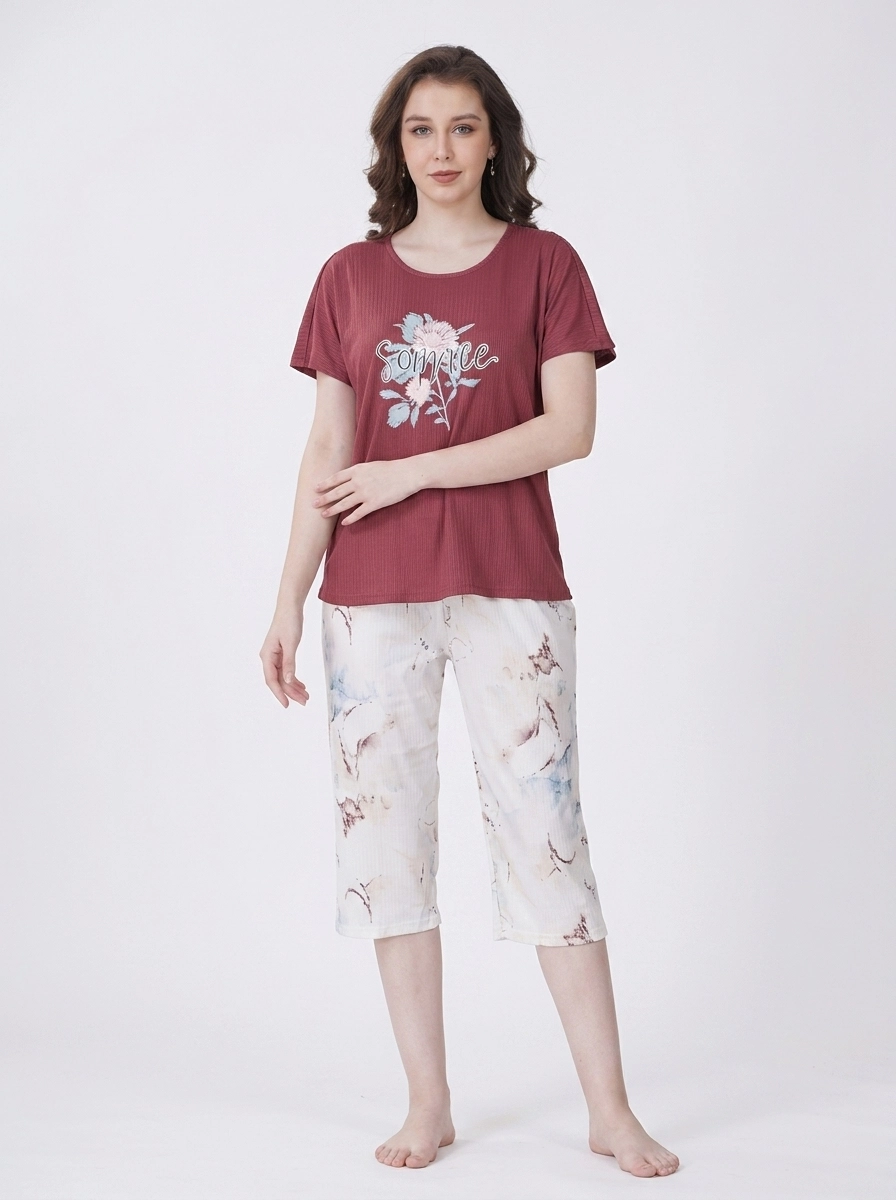 Woman_wearing_t-shirt_and_capri_202607150607 Terracotta Blossom Marble Loungewear Set - Image 1