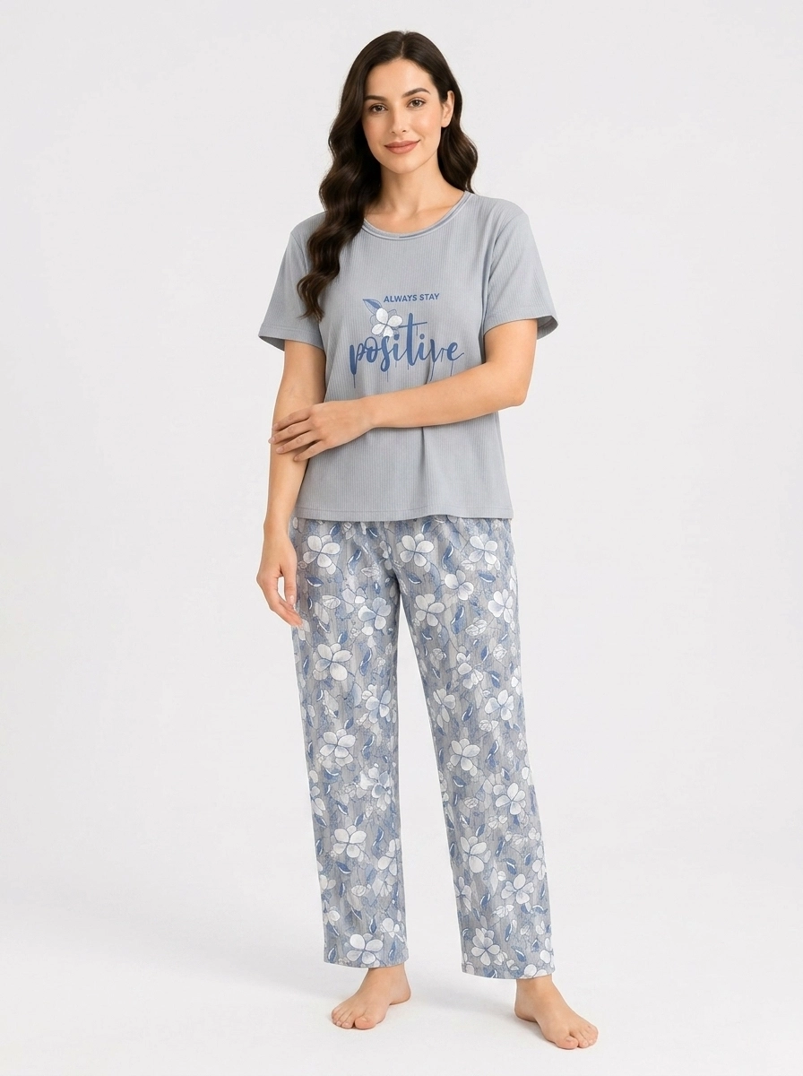 Woman_wearing_t-shirt_pajama_pants_202607150722 (2) (1) Serene Sky Meadow Graphic Loungewear Set - Image 1