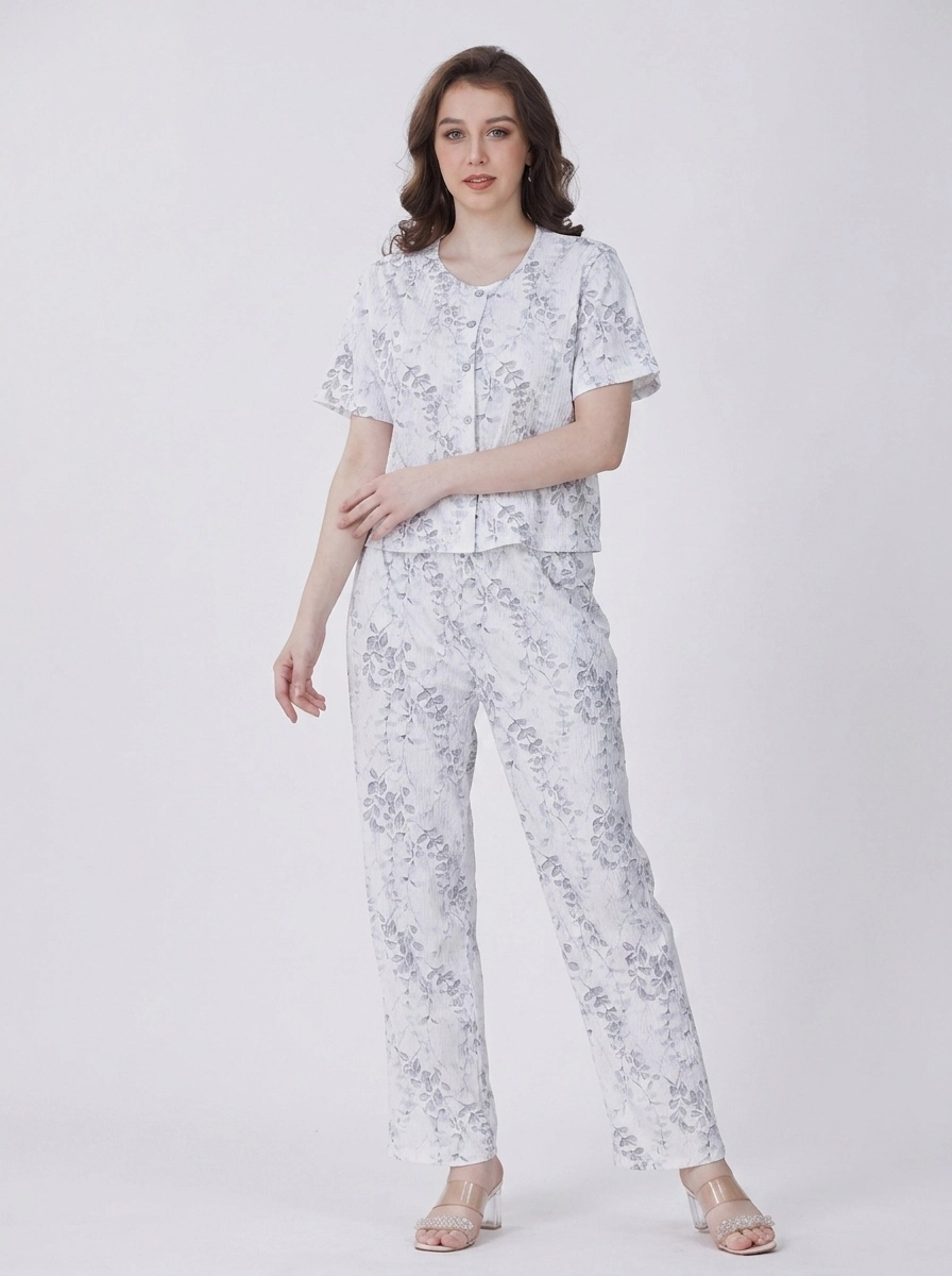 Woman_wearing_white_floral_pajamas_202607150626 Silver Willow Botanical Loungewear Set - Image 1