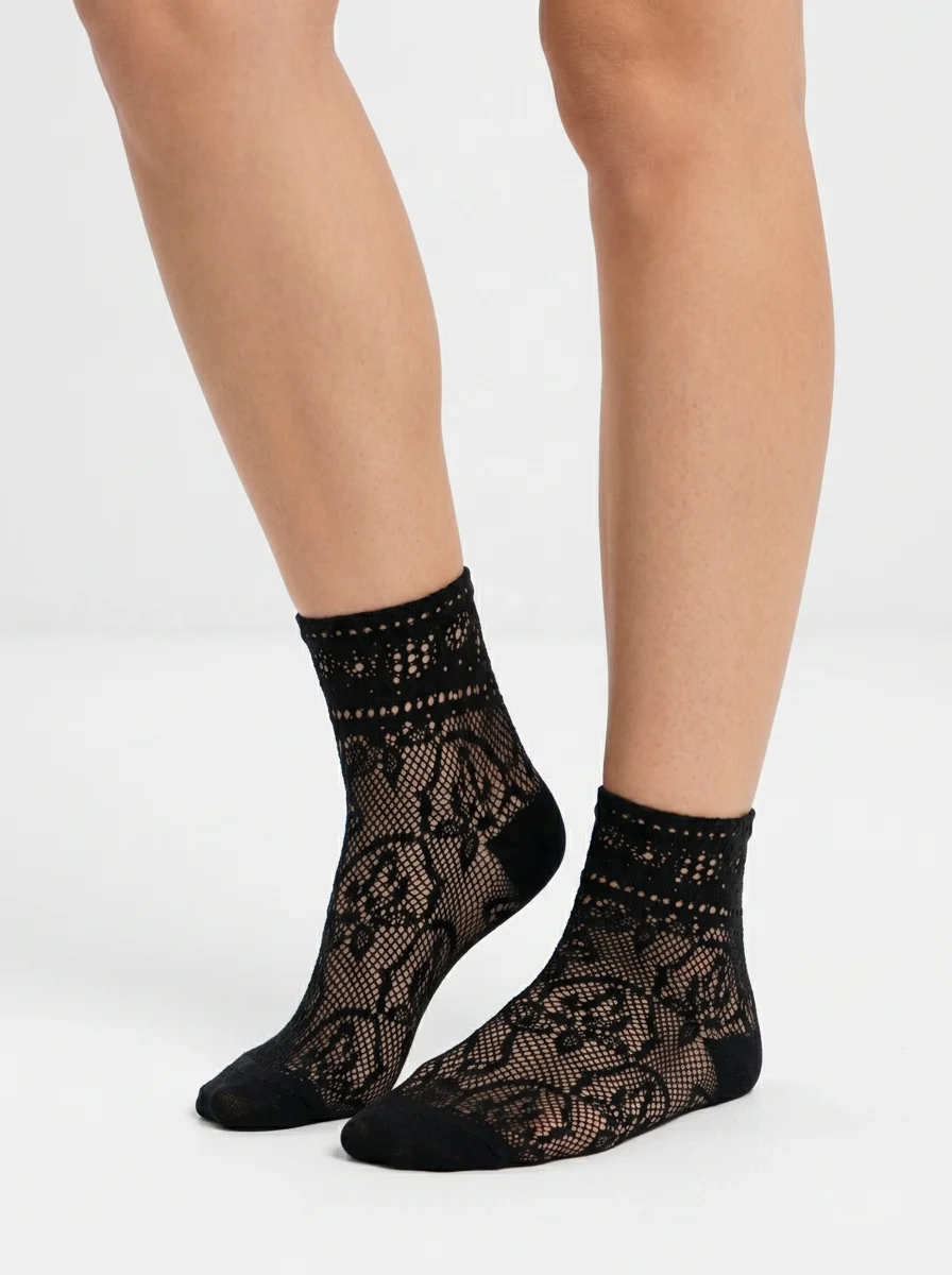 Model_wearing_black_lace_socks_202608240620 Women's Rose Silhouette Fishnet Ankle Socks - Image 1