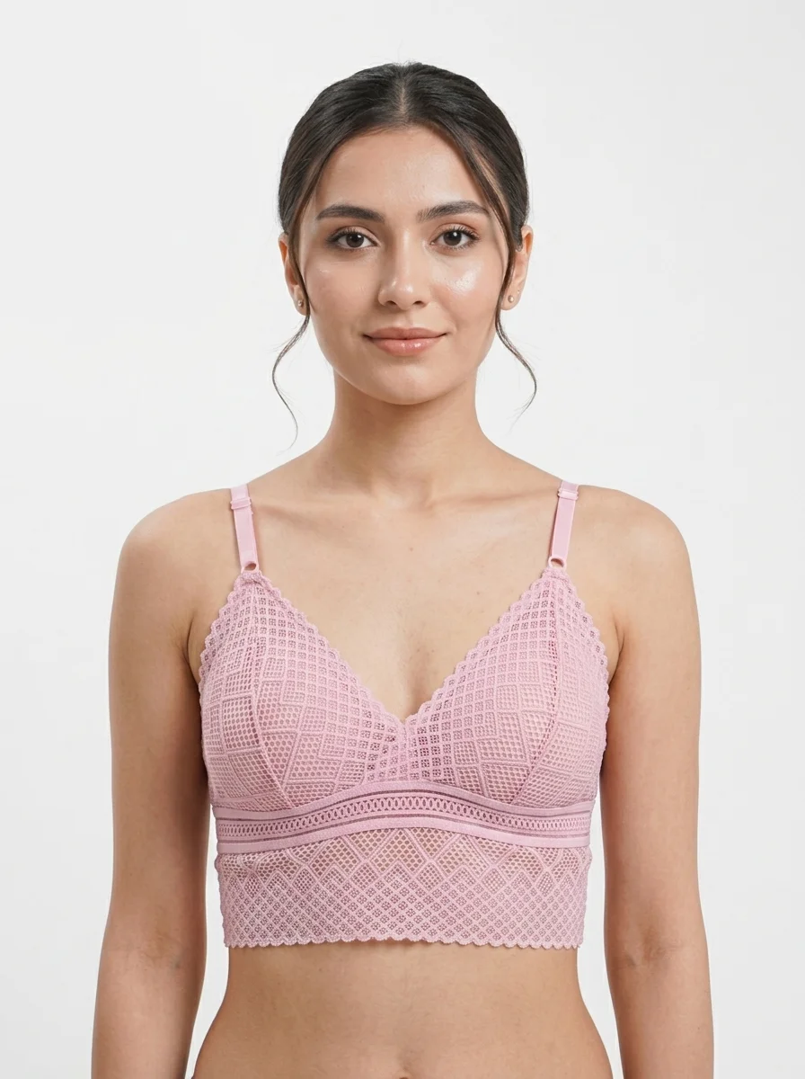 Woman_posing_in_pink_bralette_202608240123 Premium Geometric Crochet Lace Longline Bralette - Image 1