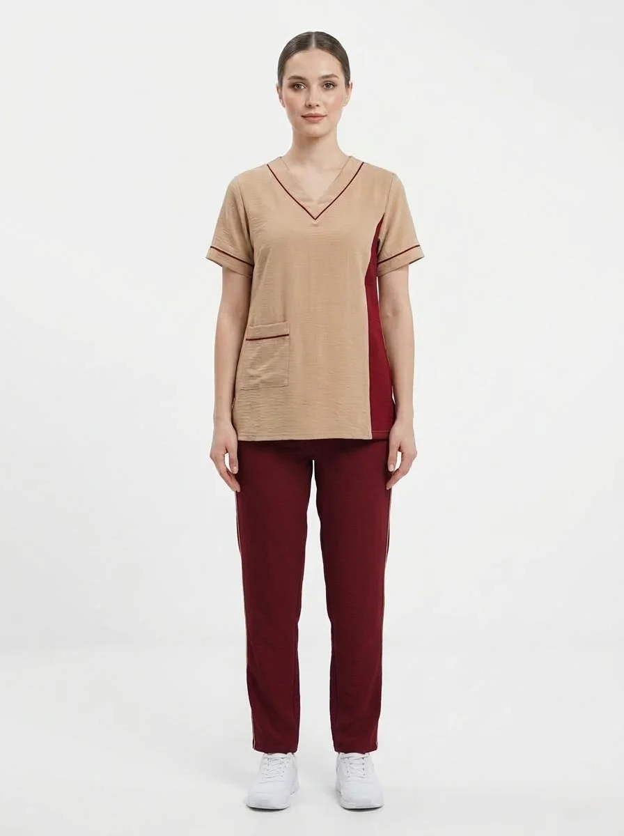 Female_model_wearing_tan_scrubs_20260914005231 Women’s Professional Healthcare & Staff Scrub Tunic Top - Image 1